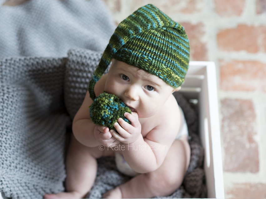 baby eating hat